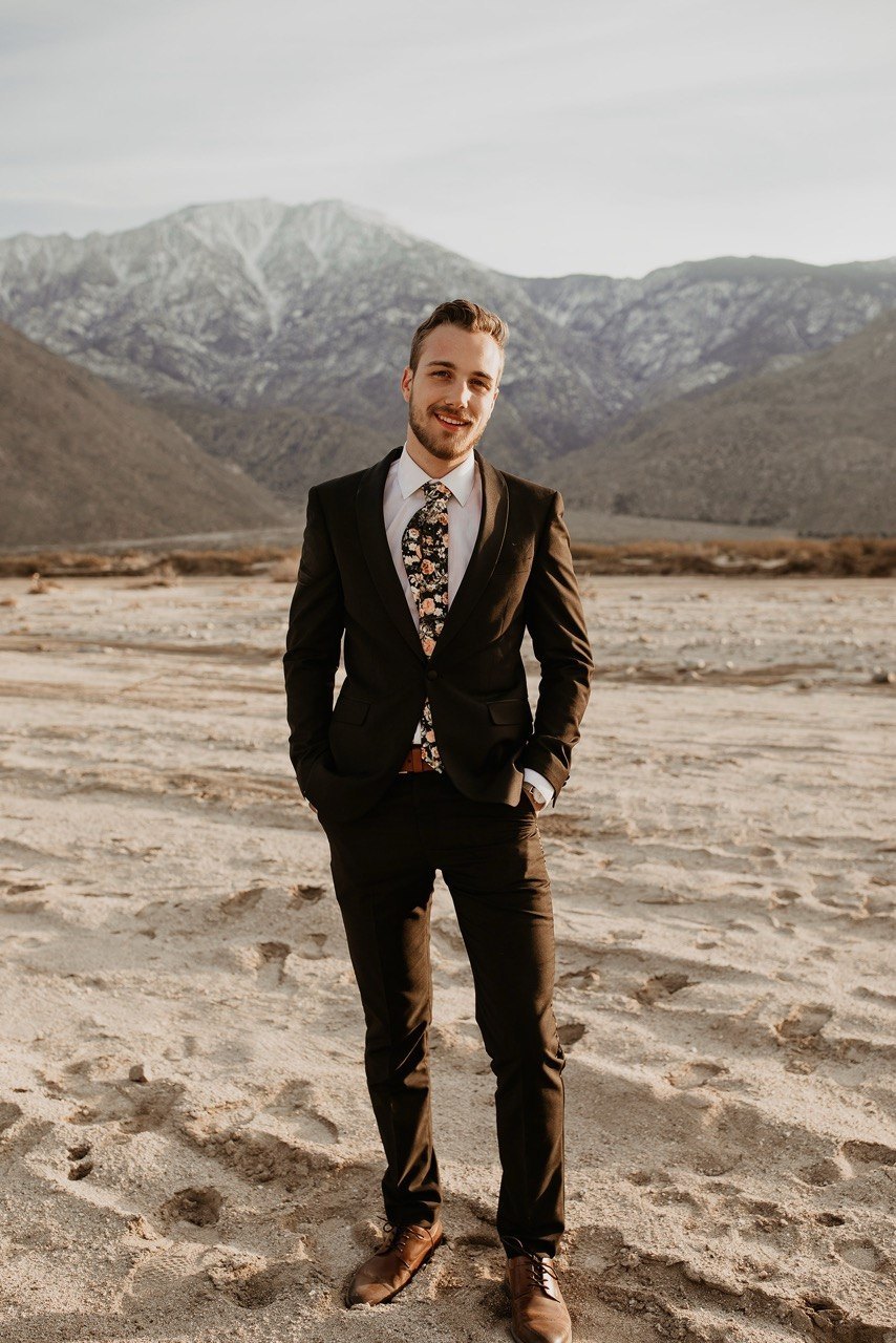 Robert Parizeau standing in front of a mountain landscape